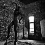 Person doing a dance in a dark room