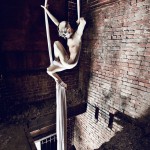 Person hanging in fabric wearing a silver helmet