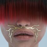 face with red bangs and golden metal detail under the nose